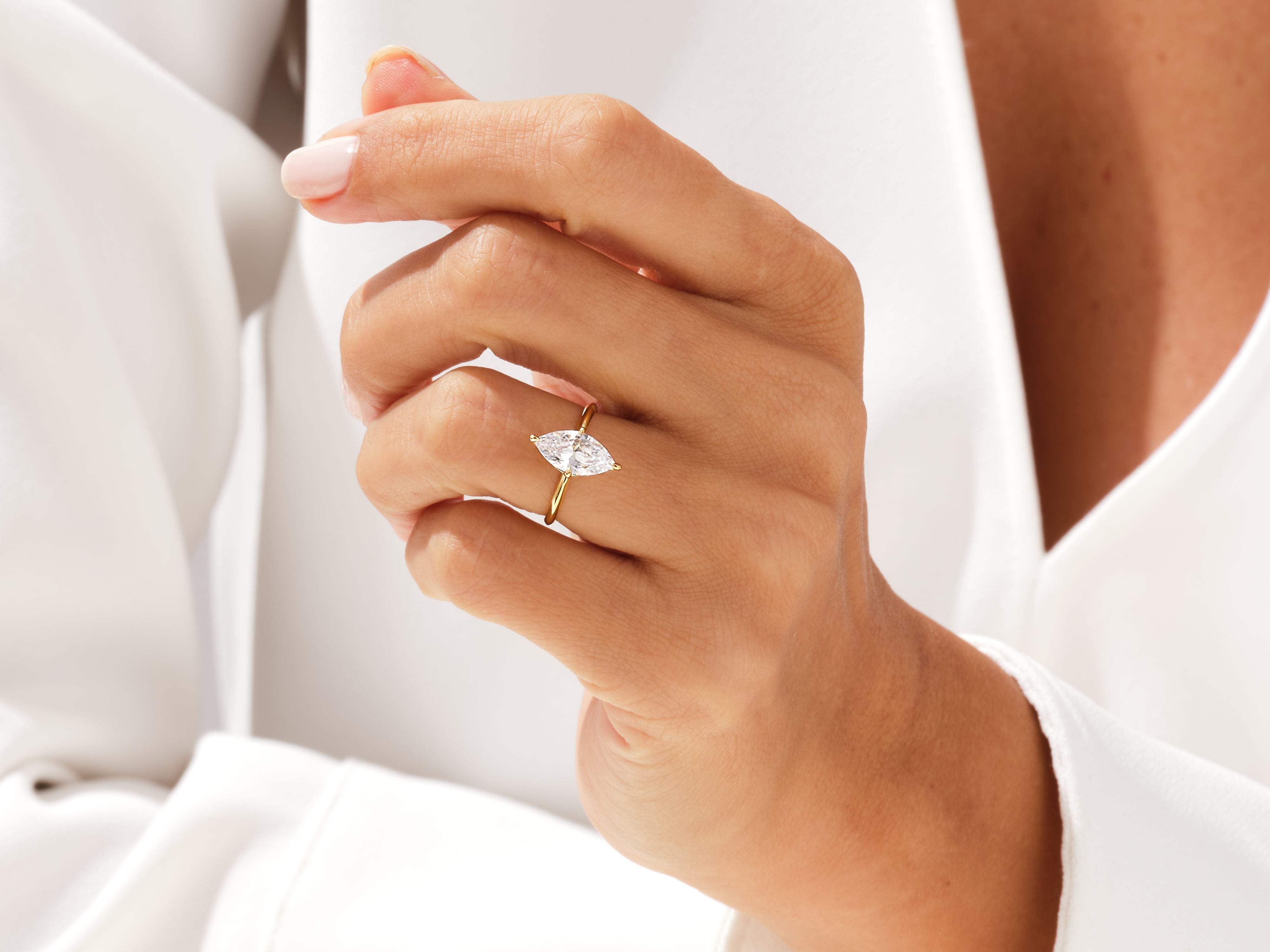 Marquise diamond engagement ring on a woman's hand