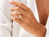 Gold ring with princess cut diamond on hand
