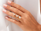 Gold pear cut diamond rings on a hand