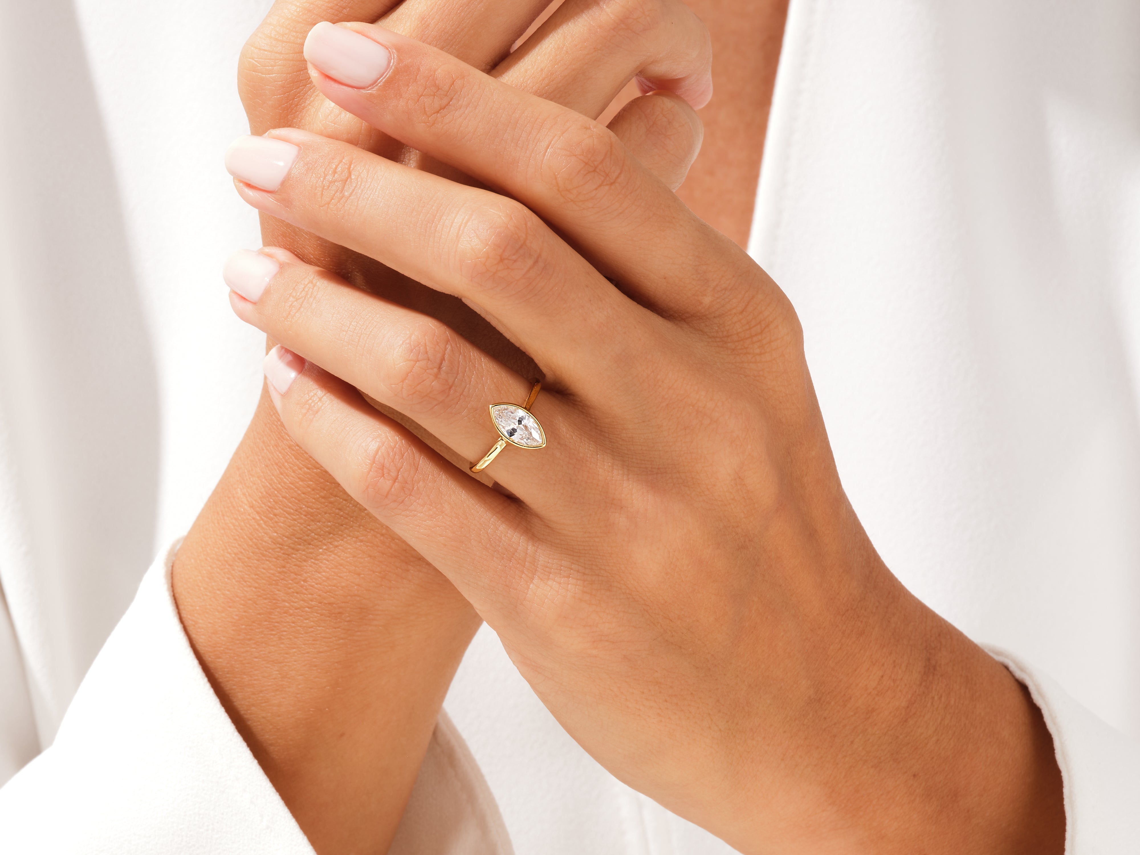 Marquise diamond engagement ring on a woman's hand