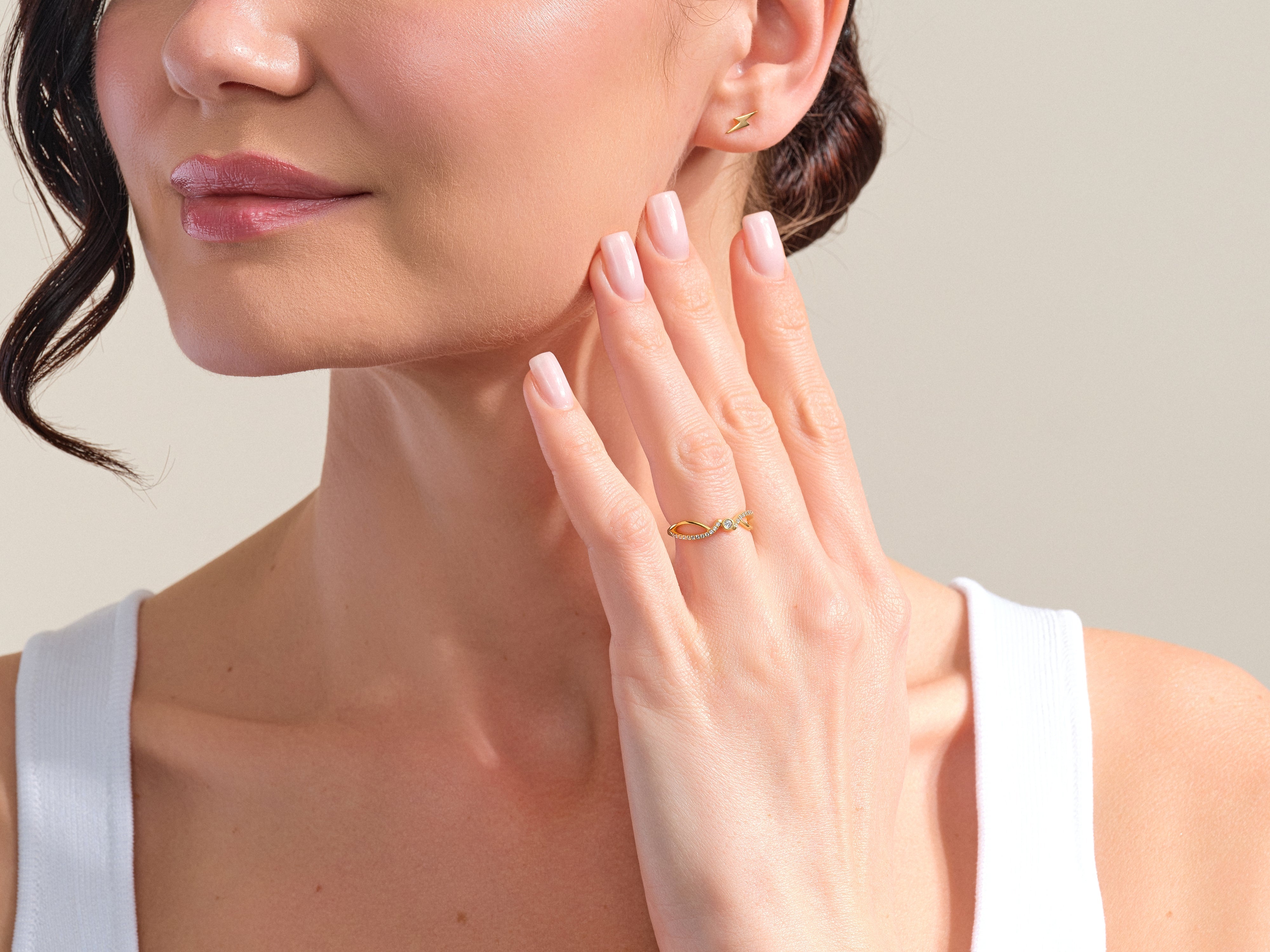 Gold infinity ring with diamonds and lightning bolt earrings