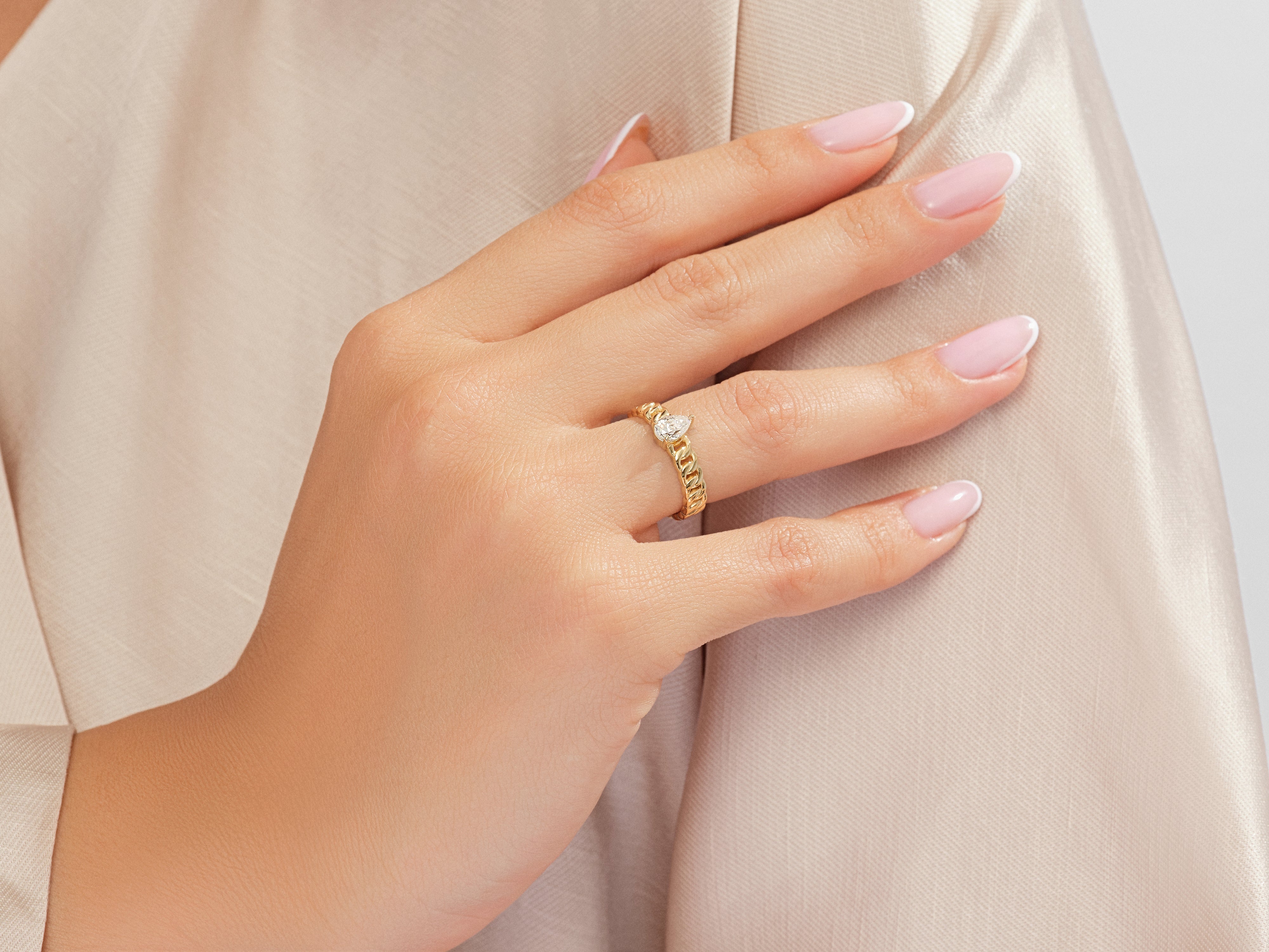 Gold chain ring with pear-shaped diamond, jewelry