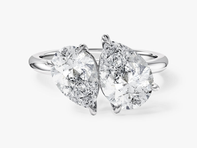 Two pear-shaped diamonds on a platinum ring