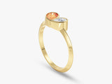 Gold ring with orange and white gemstones