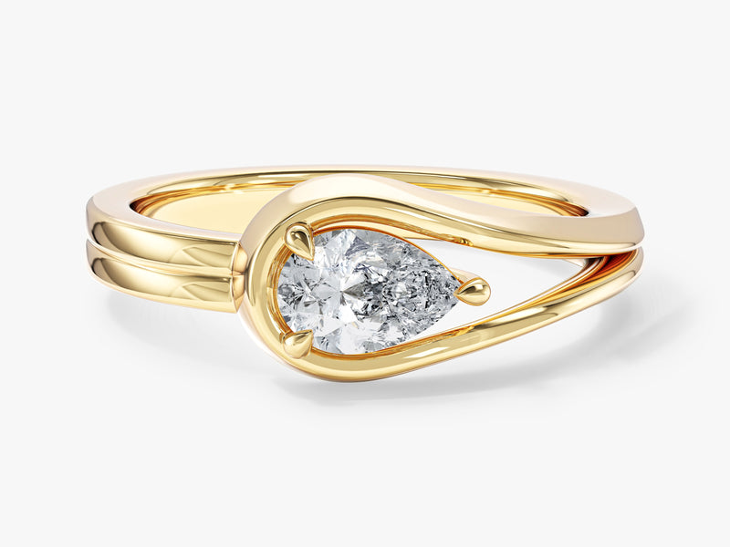 Gold ring with pear-shaped diamond engagement jewelry