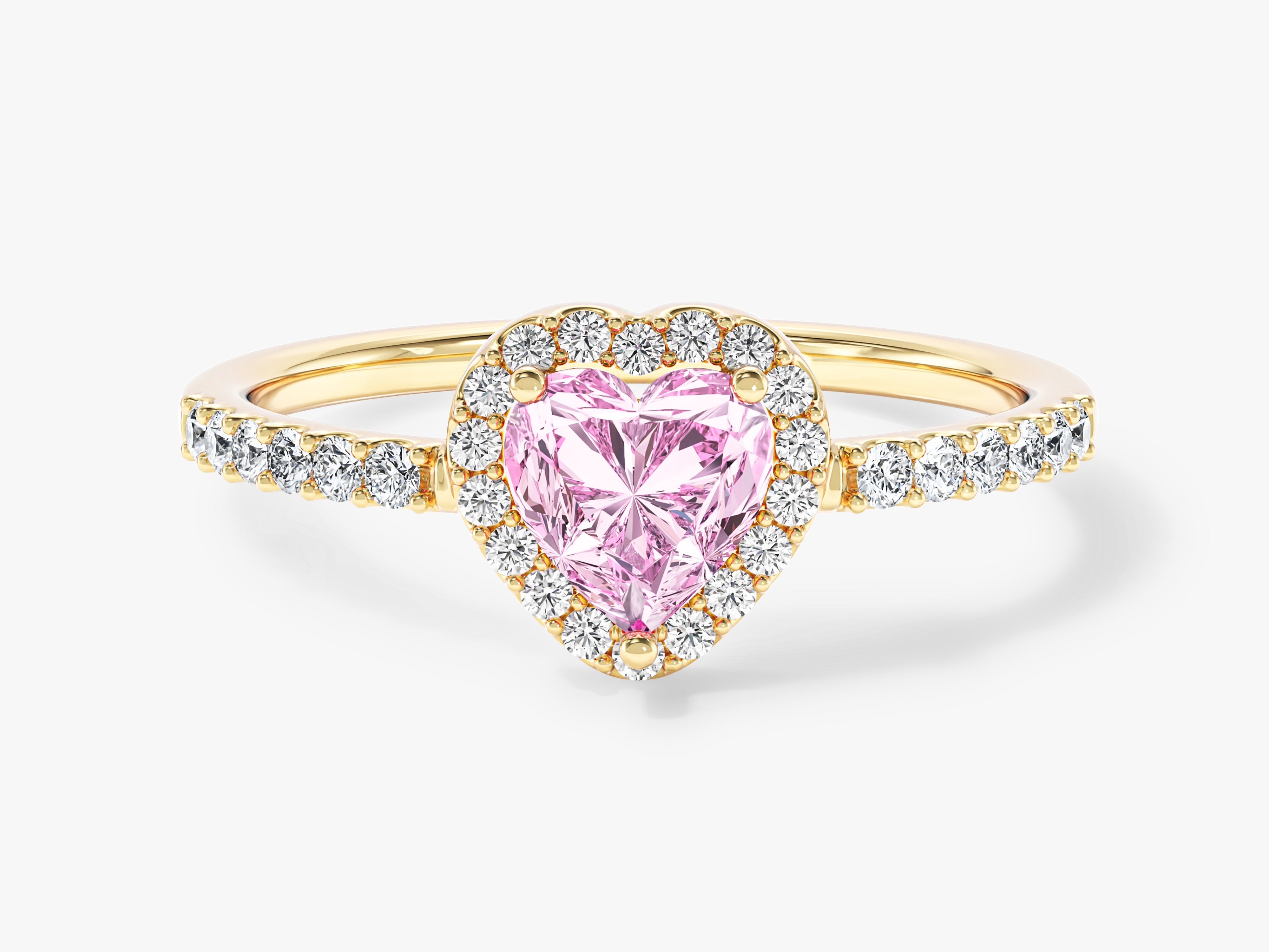 Gold ring with heart-shaped pink diamond and diamond halo