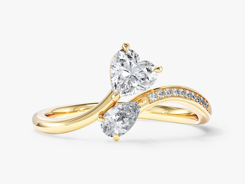 Gold ring with two diamonds, heart and pear shape, diamond band