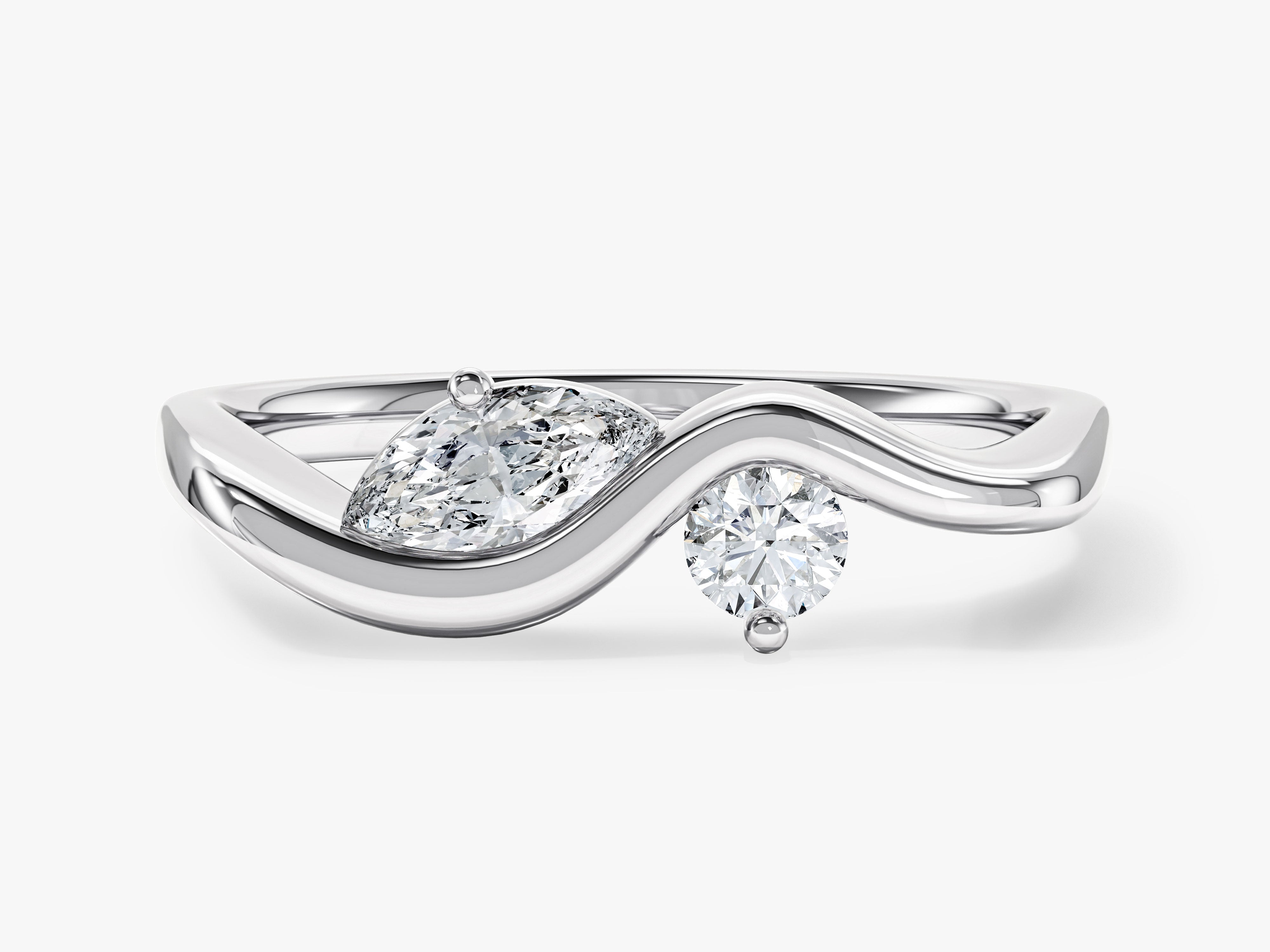 Diamond engagement ring with marquise and round cut stones