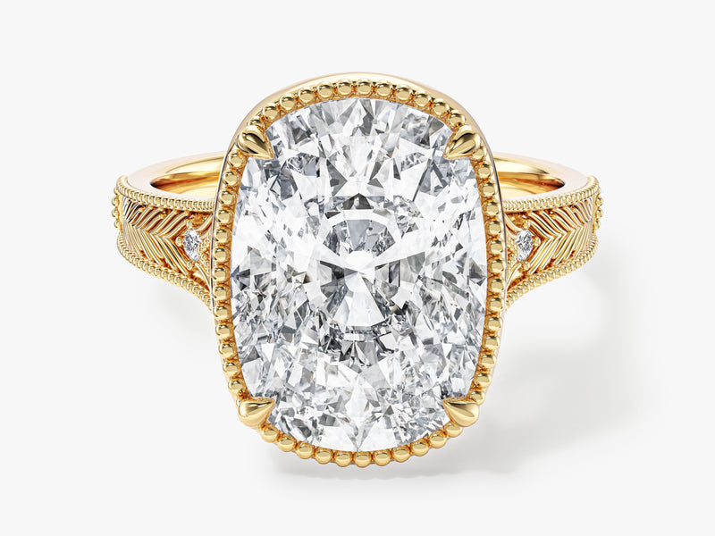 Oval diamond engagement ring in yellow gold with intricate band details