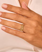 Gold curb chain ring on a hand, jewelry product