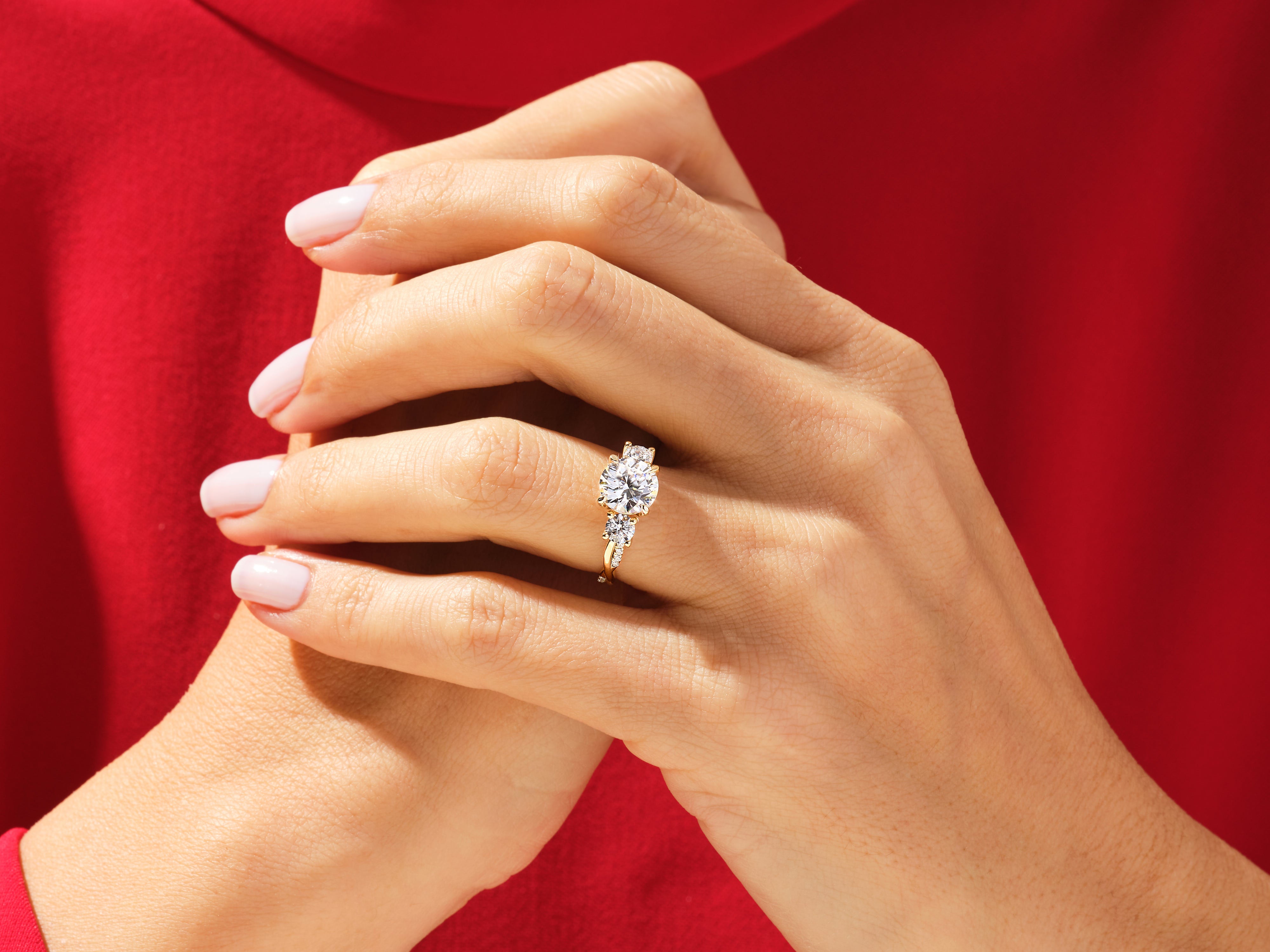Diamond engagement ring on hand, jewelry, luxury, wedding, proposal